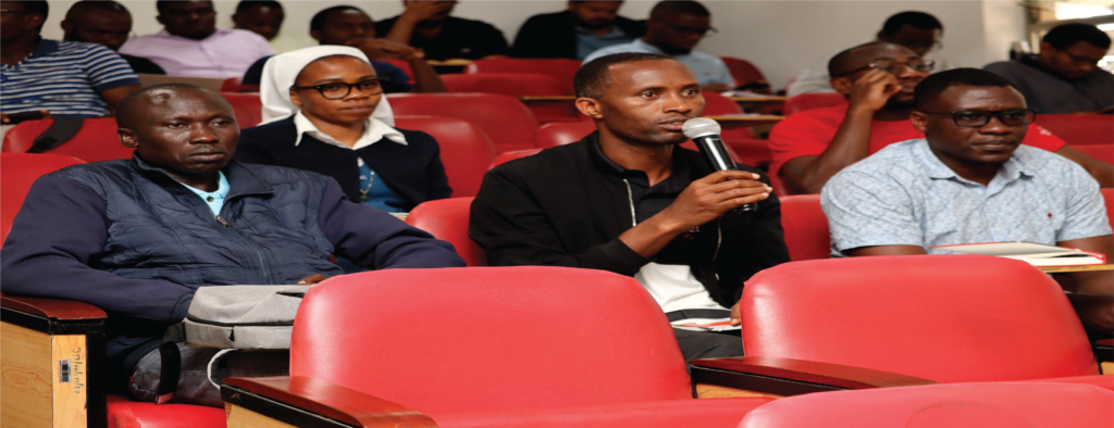 Hekima faculty and sudents at the auditorium for research week